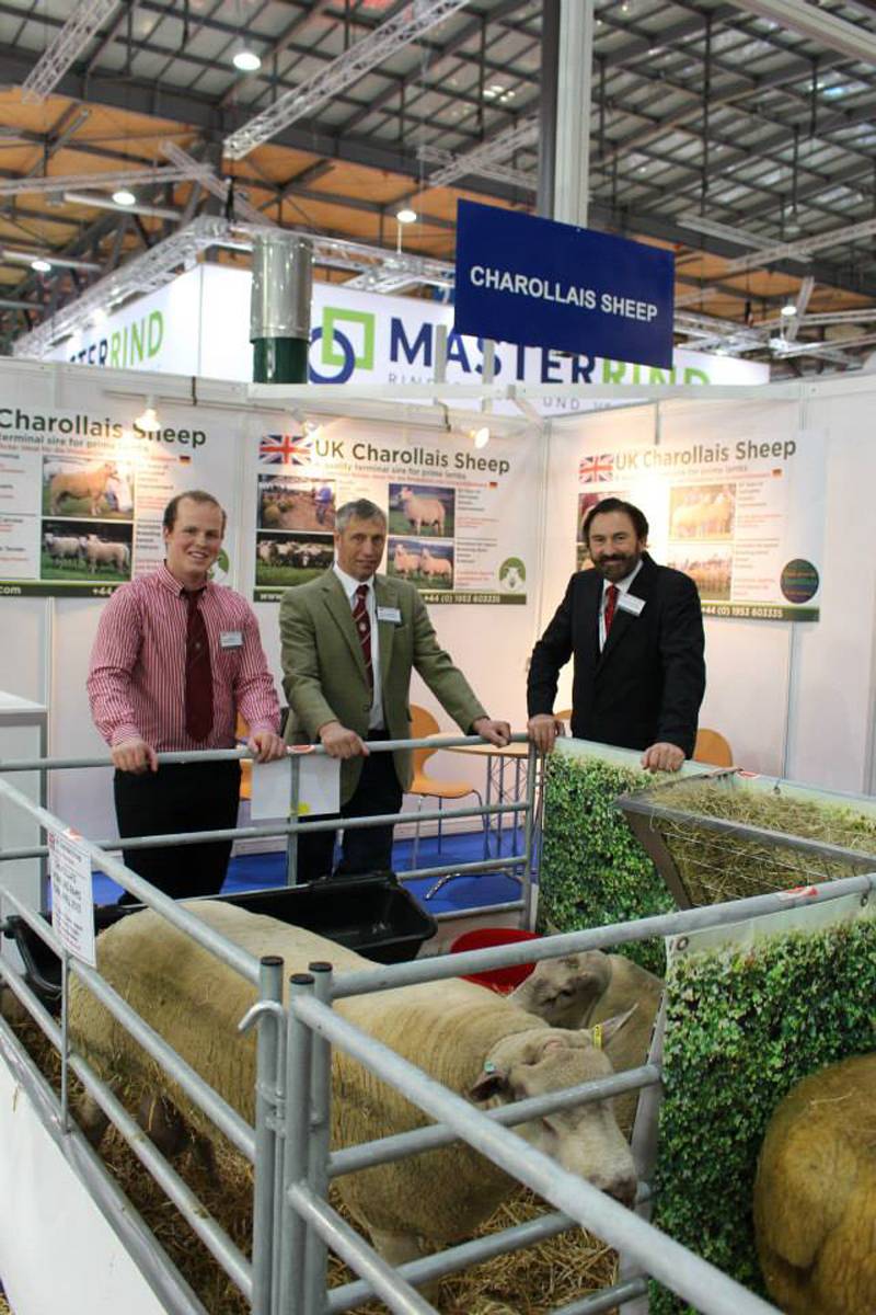 Bruce Ingram of Logie Durno Sheep standing with the Chairman and Chief Executive of the British Charollais Sheep Society